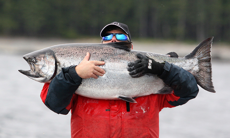 Colin Ramsden (unidentified) shows his Chinook Salmon catch